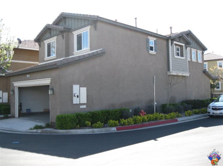 2506 Rabbit Ridge Court Palmdale, CA 93550 - Photo 3 of 15 a front view of a house with garden