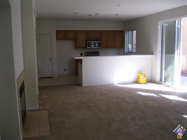 2506 Rabbit Ridge Court Palmdale, CA 93550 - Photo 5 of 15 a view of a refrigerator in kitchen and a sink