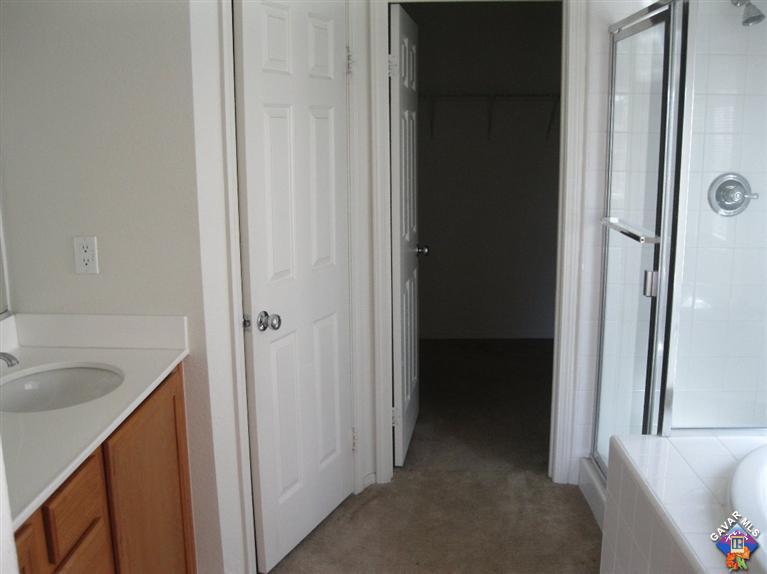 2506 Rabbit Ridge Court Palmdale, CA 93550 - Photo 10 of 15 a view of a kitchen from a hallway