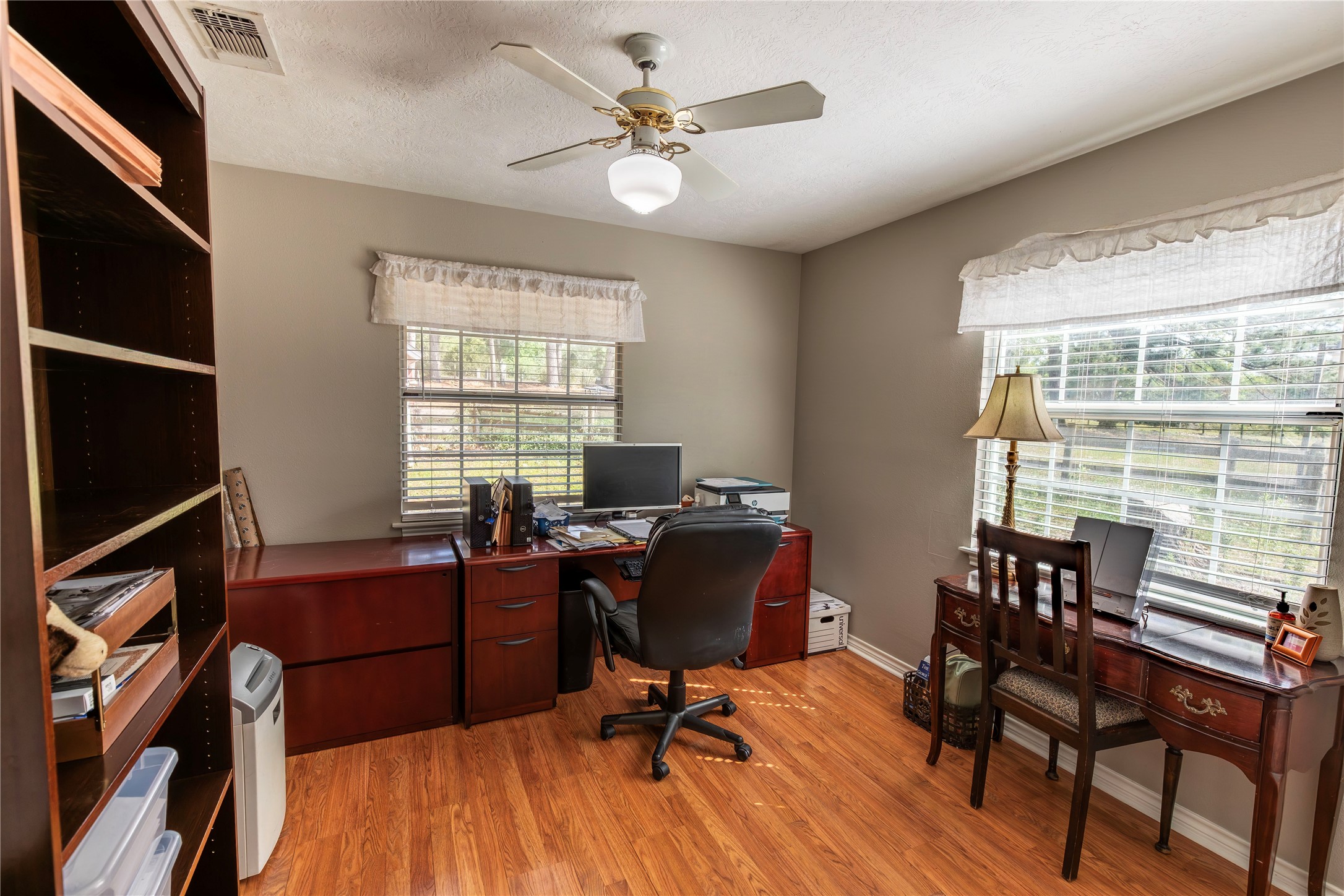 636 Deer Run Road Bellville, TX 77418 - Photo 11 of 23 a view of a livingroom with workspace and a window