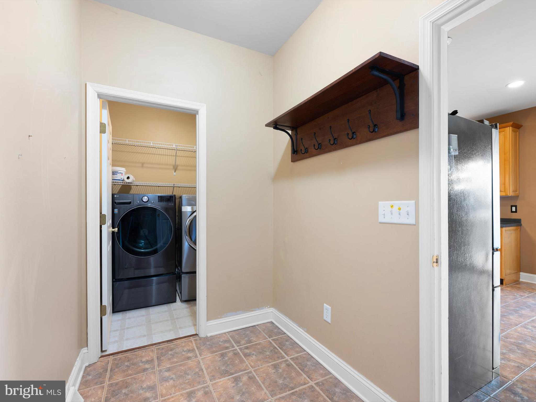 109 Chestnut Ridge Drive Magnolia, DE 19962 - Photo 14 of 44 a view of a storage and utility room with a washer and dryer