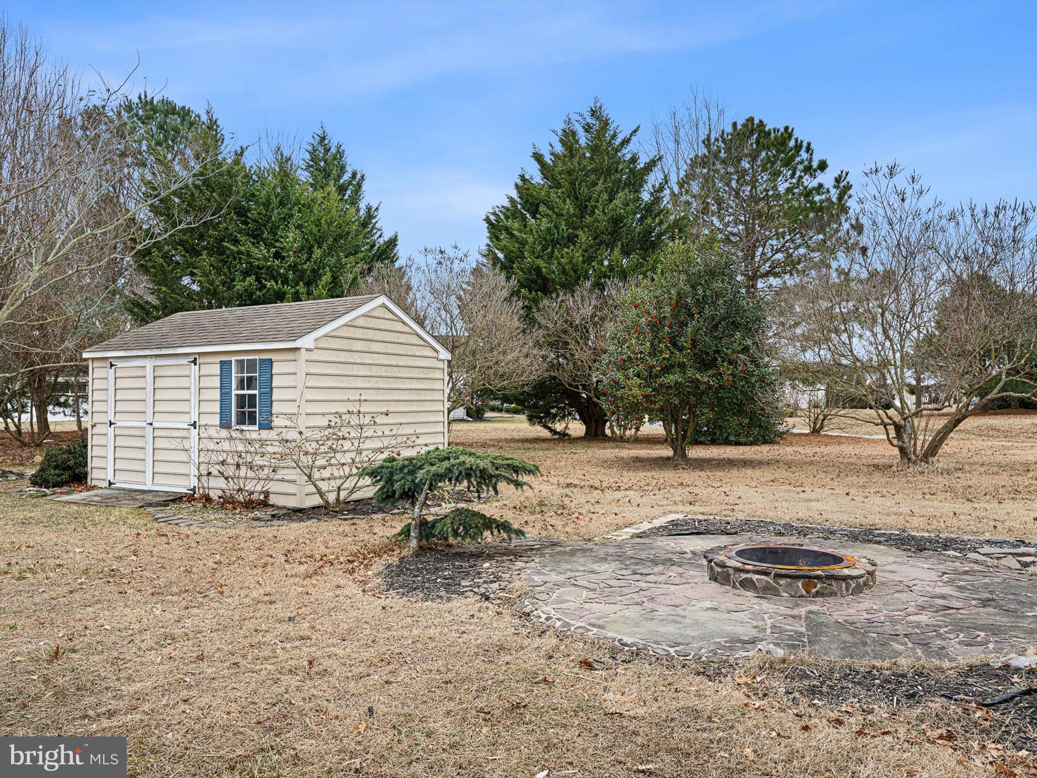 109 Chestnut Ridge Drive Magnolia, DE 19962 - Photo 39 of 44 a backyard of a house with table and chairs