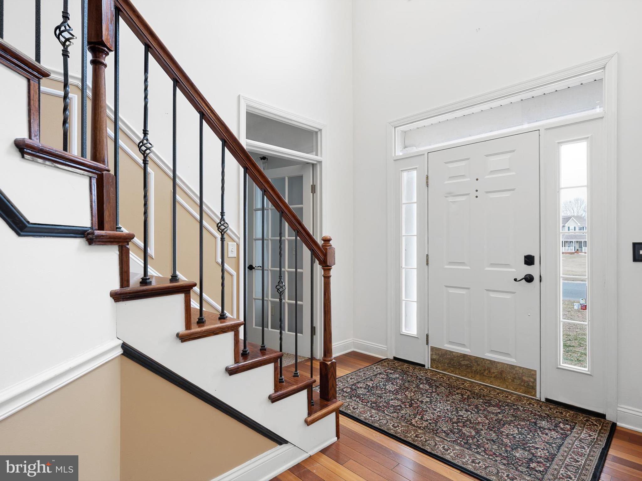 109 Chestnut Ridge Drive Magnolia, DE 19962 - Photo 4 of 44 a view of staircase with wooden floor and a rug