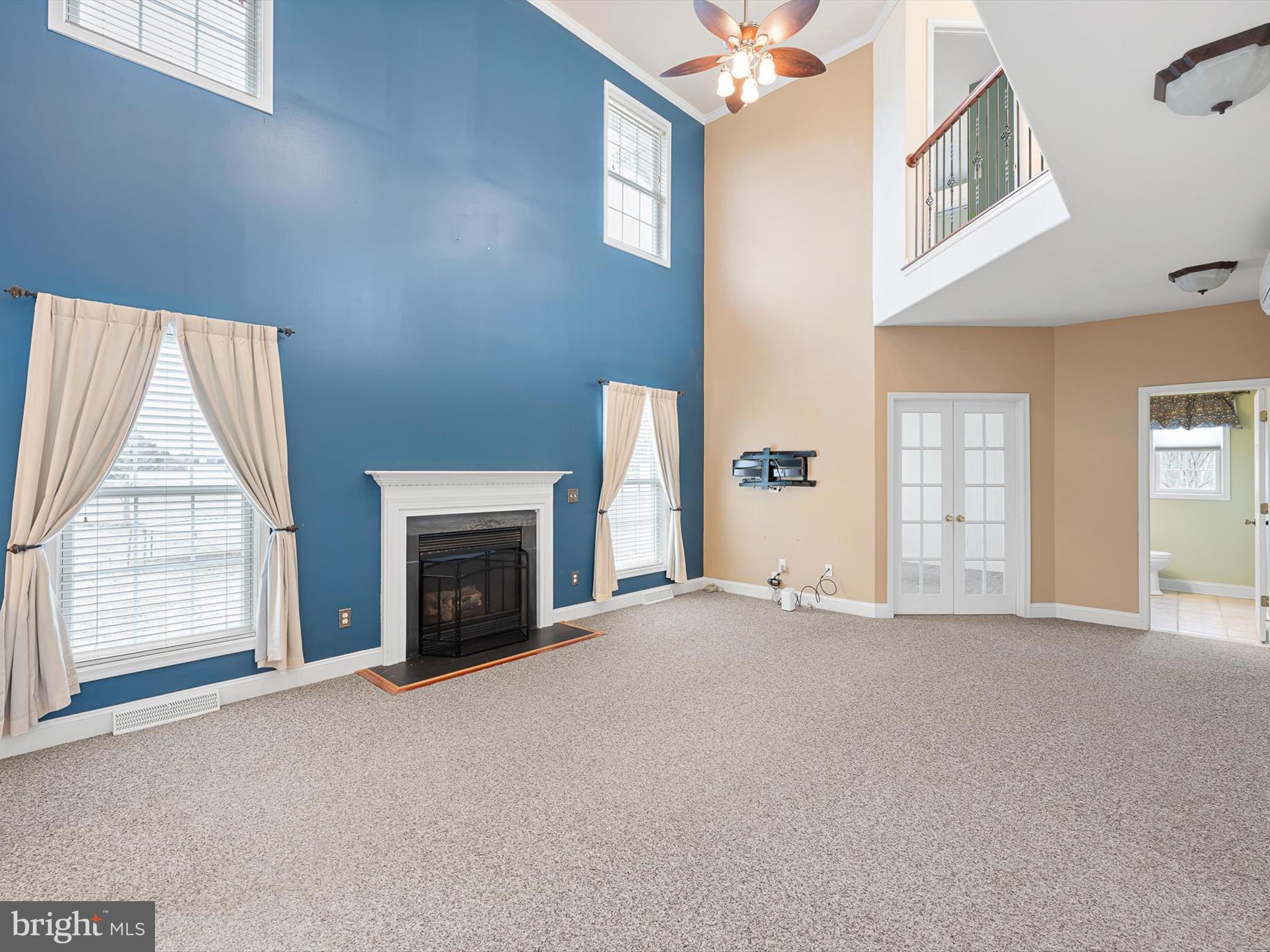 109 Chestnut Ridge Drive Magnolia, DE 19962 - Photo 7 of 44 a view of an empty room with a fireplace and a window