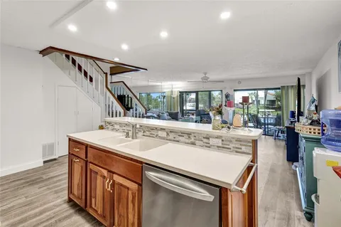 a kitchen with counter top space and sink