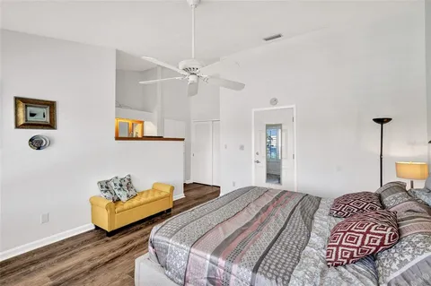 a bedroom with a bed and a couch