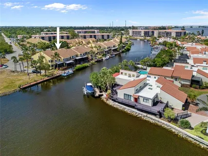 an aerial view of a house with a ocean view
