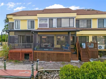 a view of a brick house with a large window