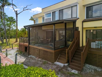 a view of a chair and table in the patio