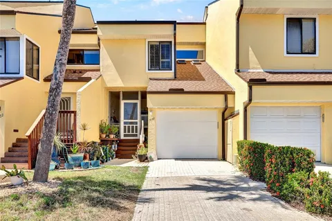 a view of a garden with flowers and trees