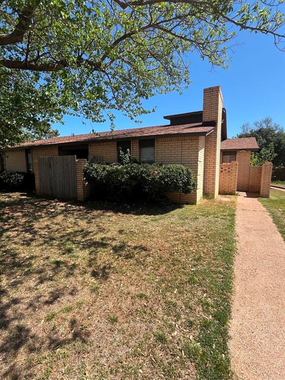 Undisclosed Address Abilene, TX 79606 - Photo 1 of 1 a front view of a house with a yard