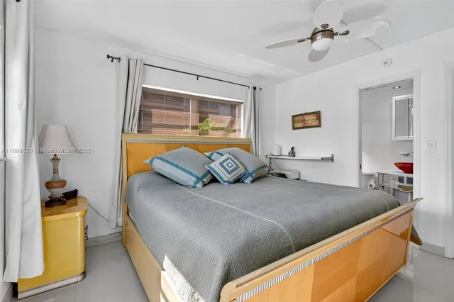 a bedroom with a bed and dresser