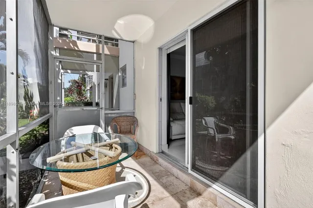 a room with furniture and a glass door shower