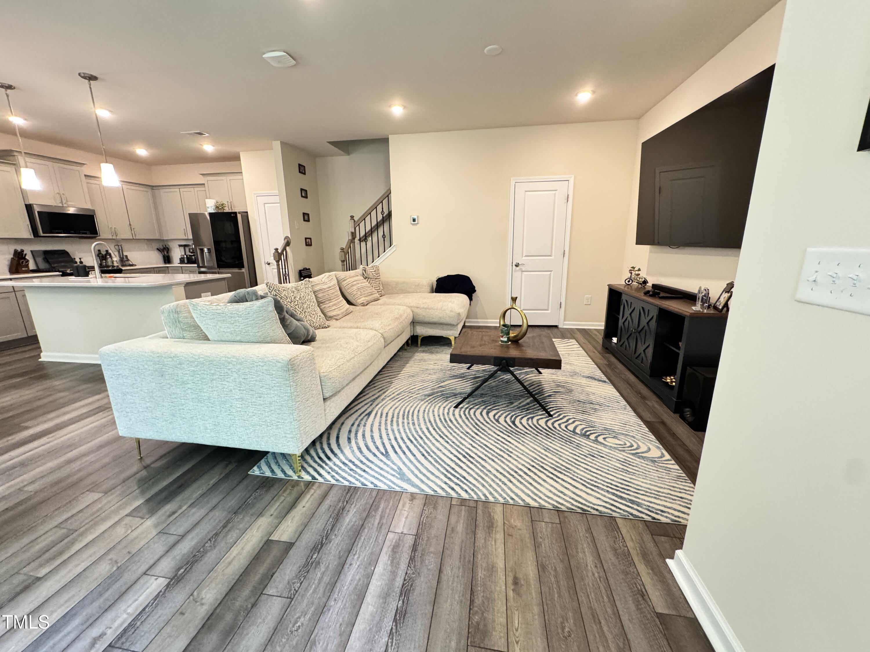 422 Notre Dame Drive Durham, NC 27713 - Photo 9 of 26 a living room with furniture and a flat screen tv