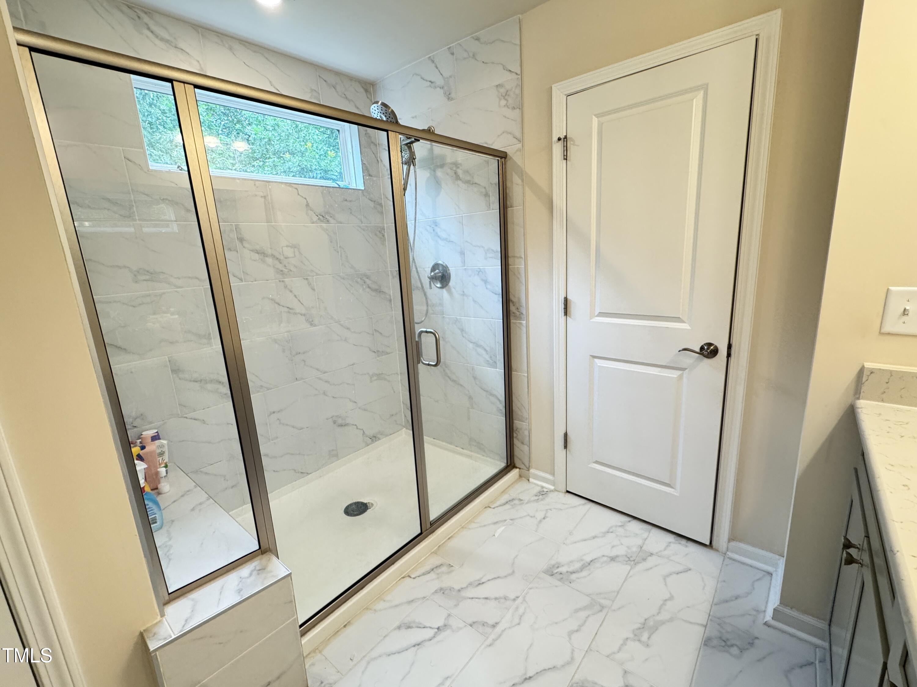 422 Notre Dame Drive Durham, NC 27713 - Photo 16 of 26 a bathroom with a glass shower door and a sink