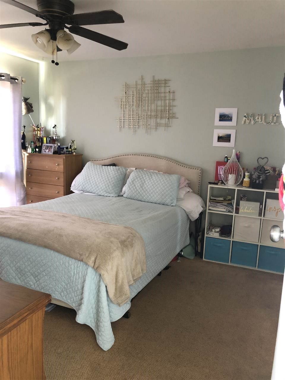 3740 Lower Honoapiilani Road, Unit B103 Lahaina, HI 96761 - Photo 15 of 16 a bedroom with a bed and ceiling fan