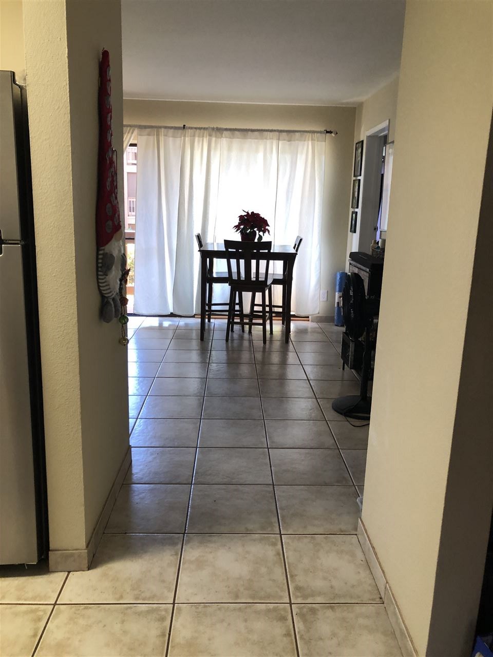 3740 Lower Honoapiilani Road, Unit B103 Lahaina, HI 96761 - Photo 16 of 16 a view of a dining room with furniture and window