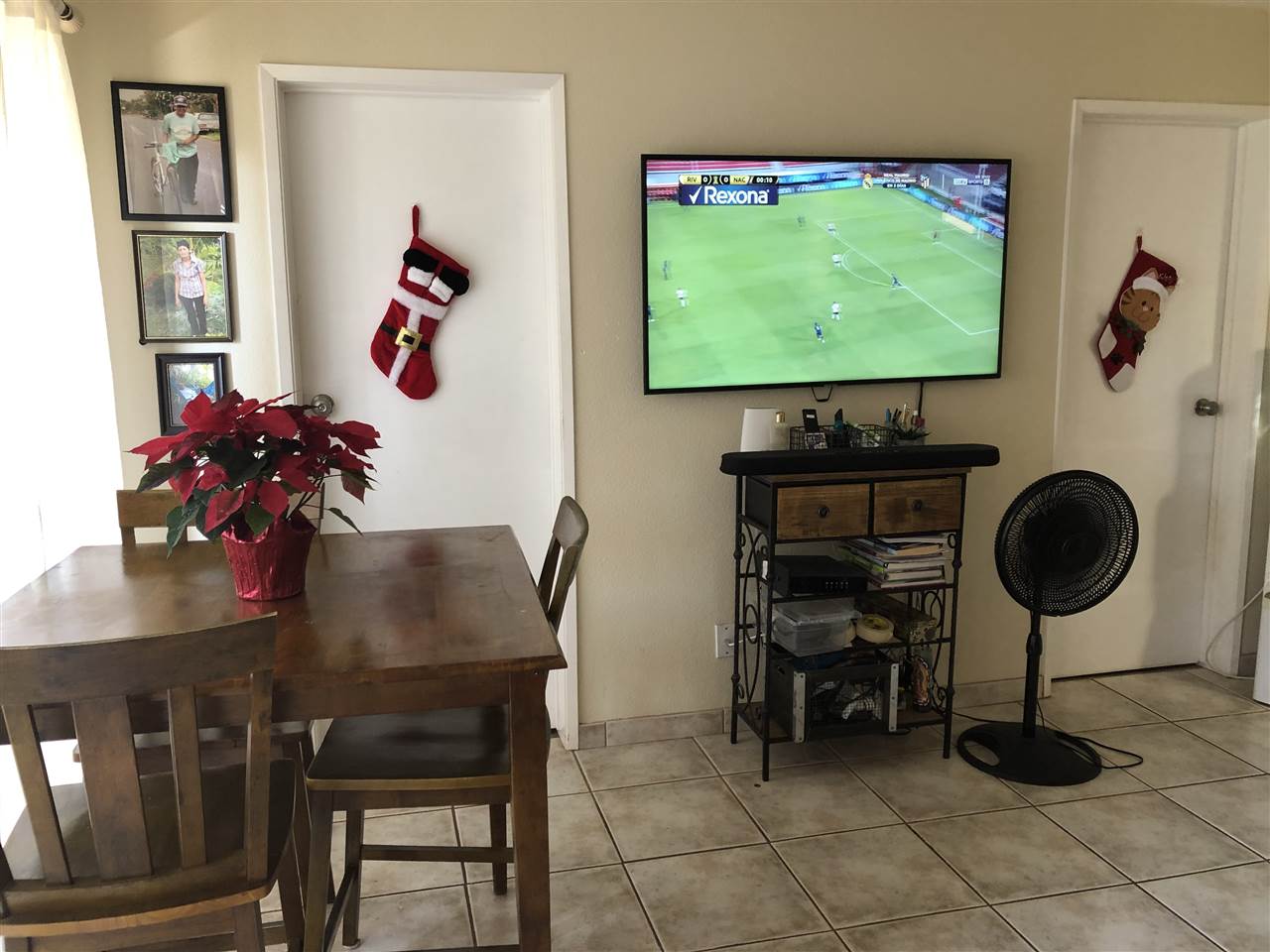 3740 Lower Honoapiilani Road, Unit B103 Lahaina, HI 96761 - Photo 2 of 16 a living room with furniture and a flat screen tv