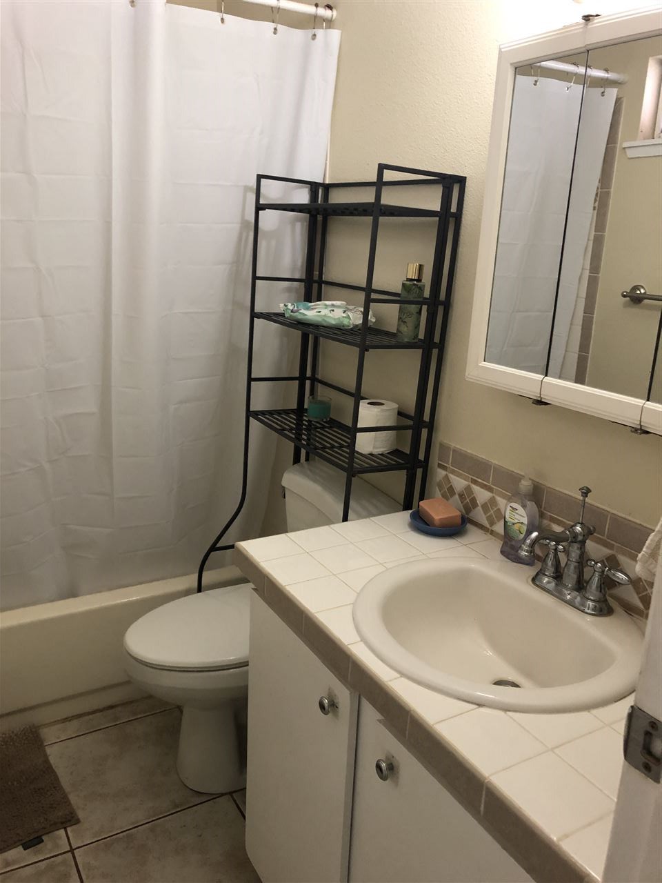 3740 Lower Honoapiilani Road, Unit B103 Lahaina, HI 96761 - Photo 8 of 16 a bathroom with a sink toilet and mirror