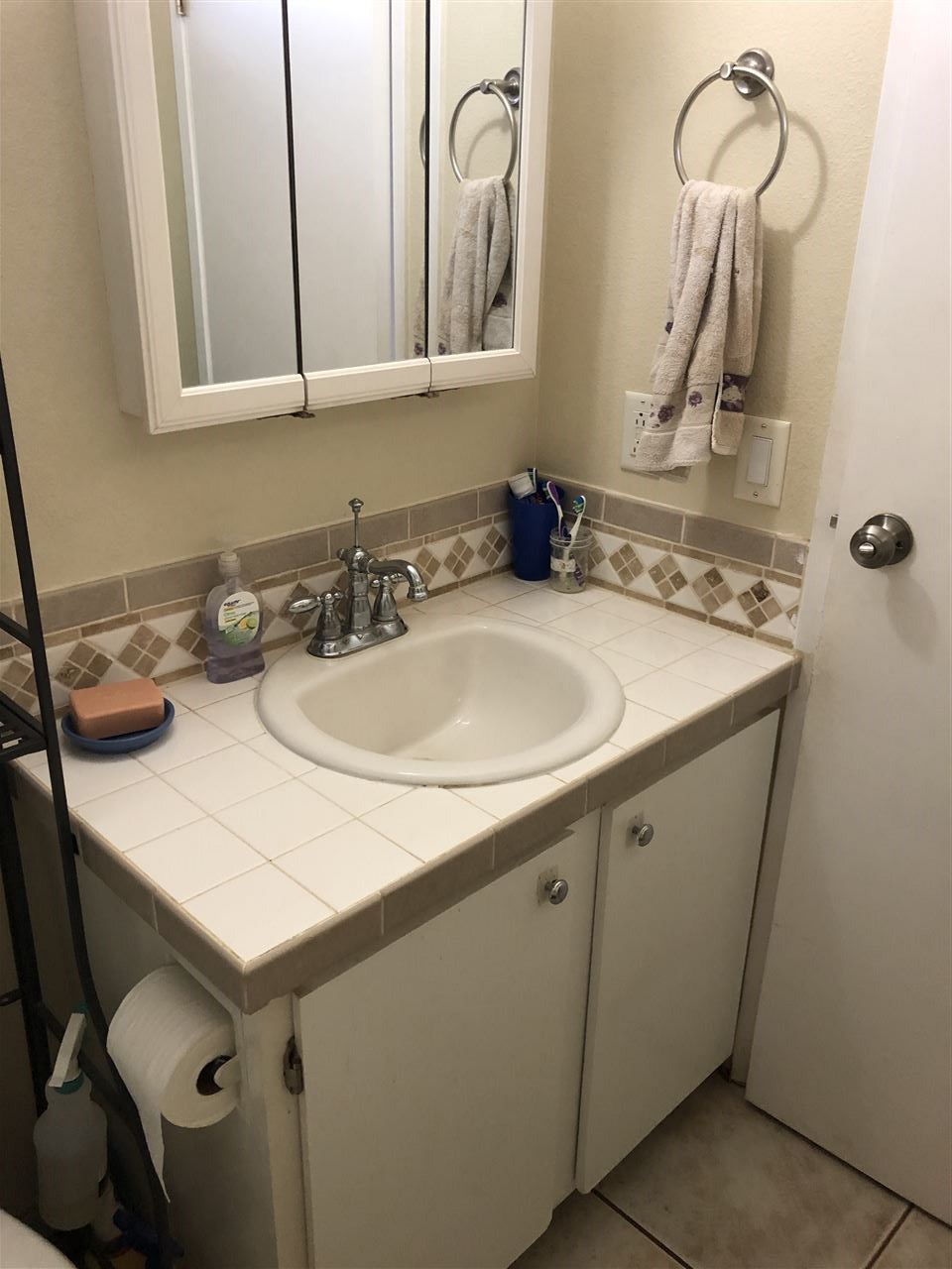 3740 Lower Honoapiilani Road, Unit B103 Lahaina, HI 96761 - Photo 9 of 16 a bathroom with a sink and a mirror
