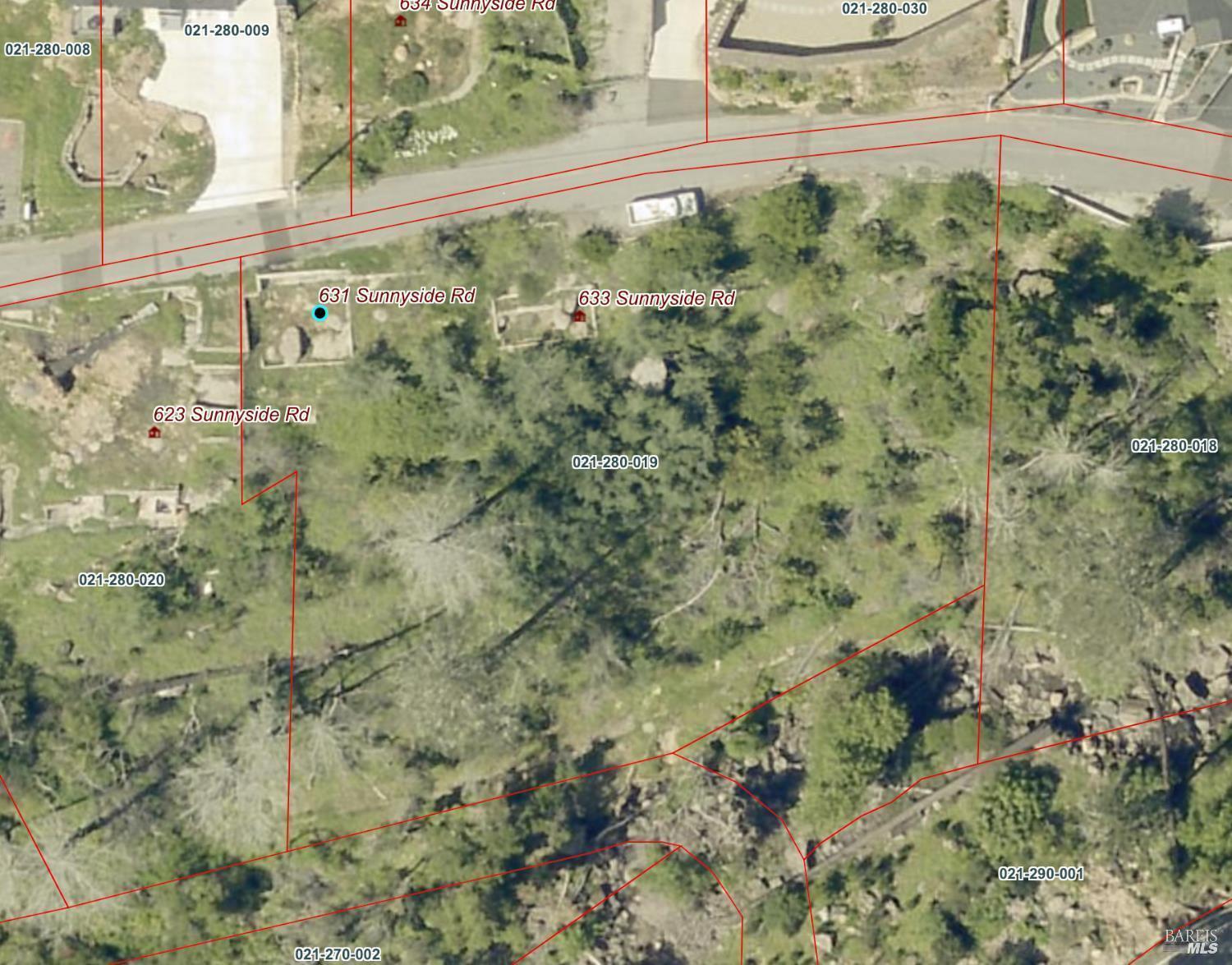 631-633 Sunnyside Road St. Helena, CA 94574 - Photo 14 of 18 a view of a forest with a wall