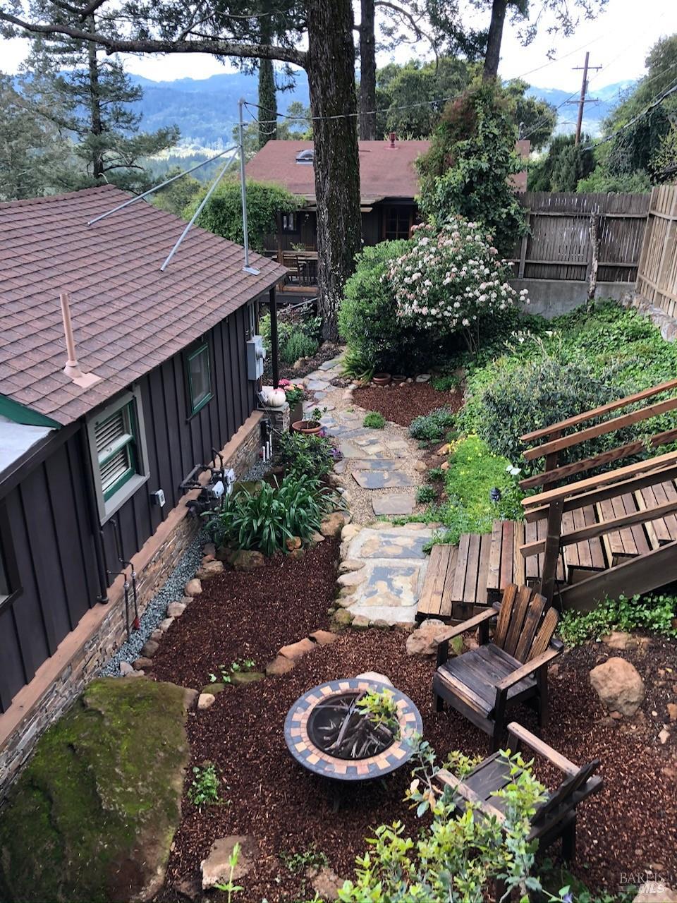 631-633 Sunnyside Road St. Helena, CA 94574 - Photo 3 of 18 a view of house with backyard space and garden
