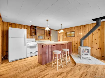 a kitchen with stainless steel appliances a stove and a refrigerator