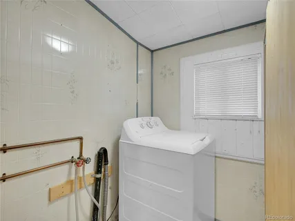 a bathroom with a toilet a sink and bathtub