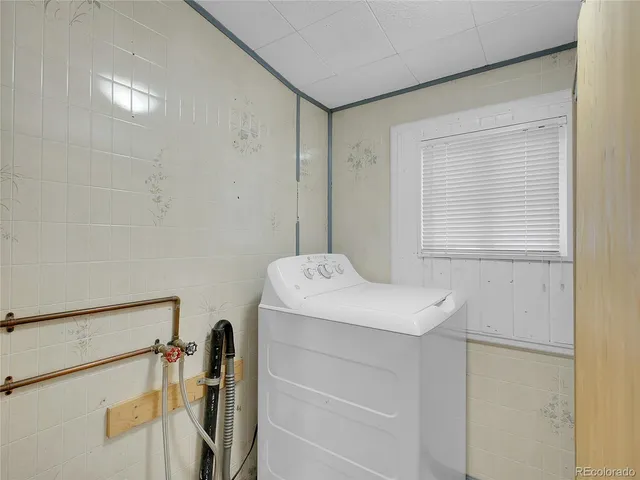 a bathroom with a toilet a sink and bathtub