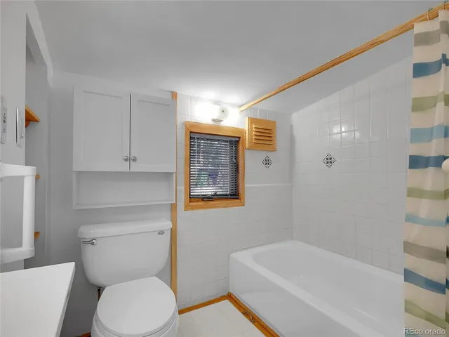 a bathroom with a bathtub and shower