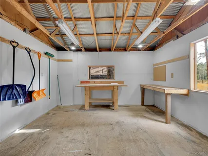 a view of outdoor space with garden and trees