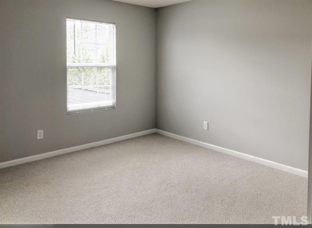 208 Rapp Lane Apex, NC 27502 - Photo 2 of 16 an empty room with a window