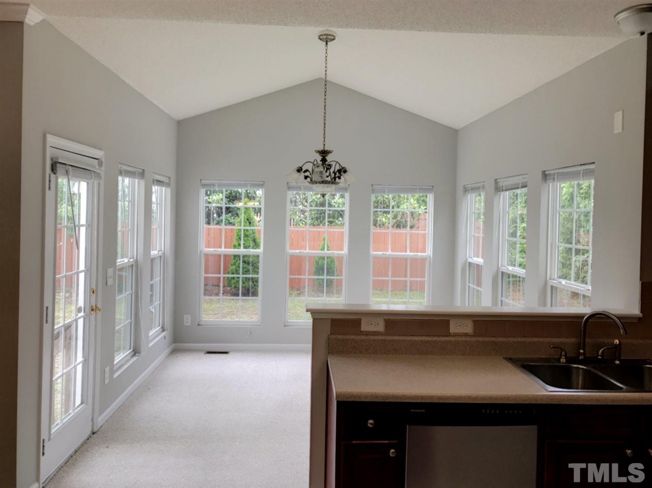 208 Rapp Lane Apex, NC 27502 - Photo 7 of 16 a kitchen with a sink and a window