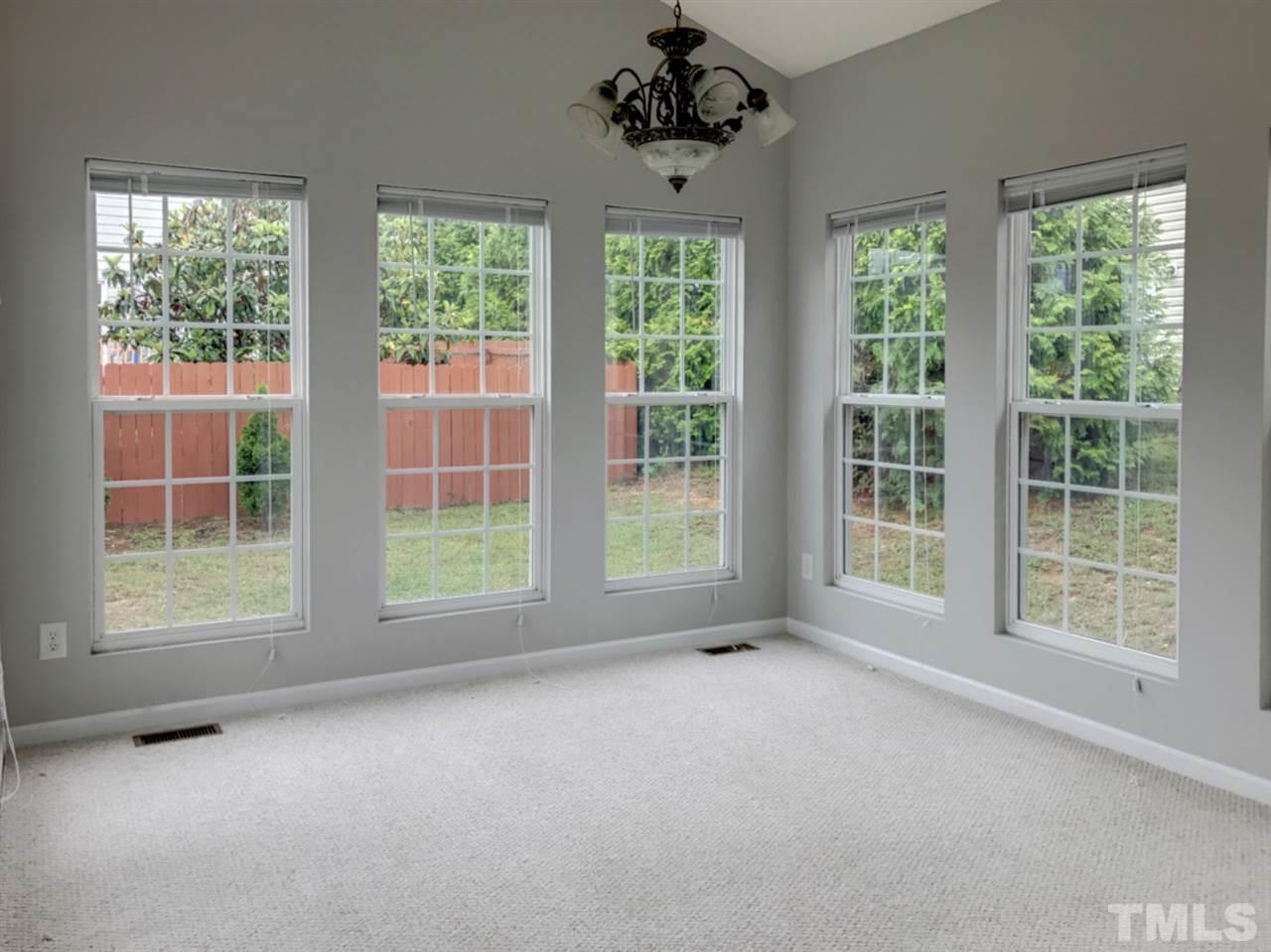 208 Rapp Lane Apex, NC 27502 - Photo 8 of 16 a view of an empty room with windows