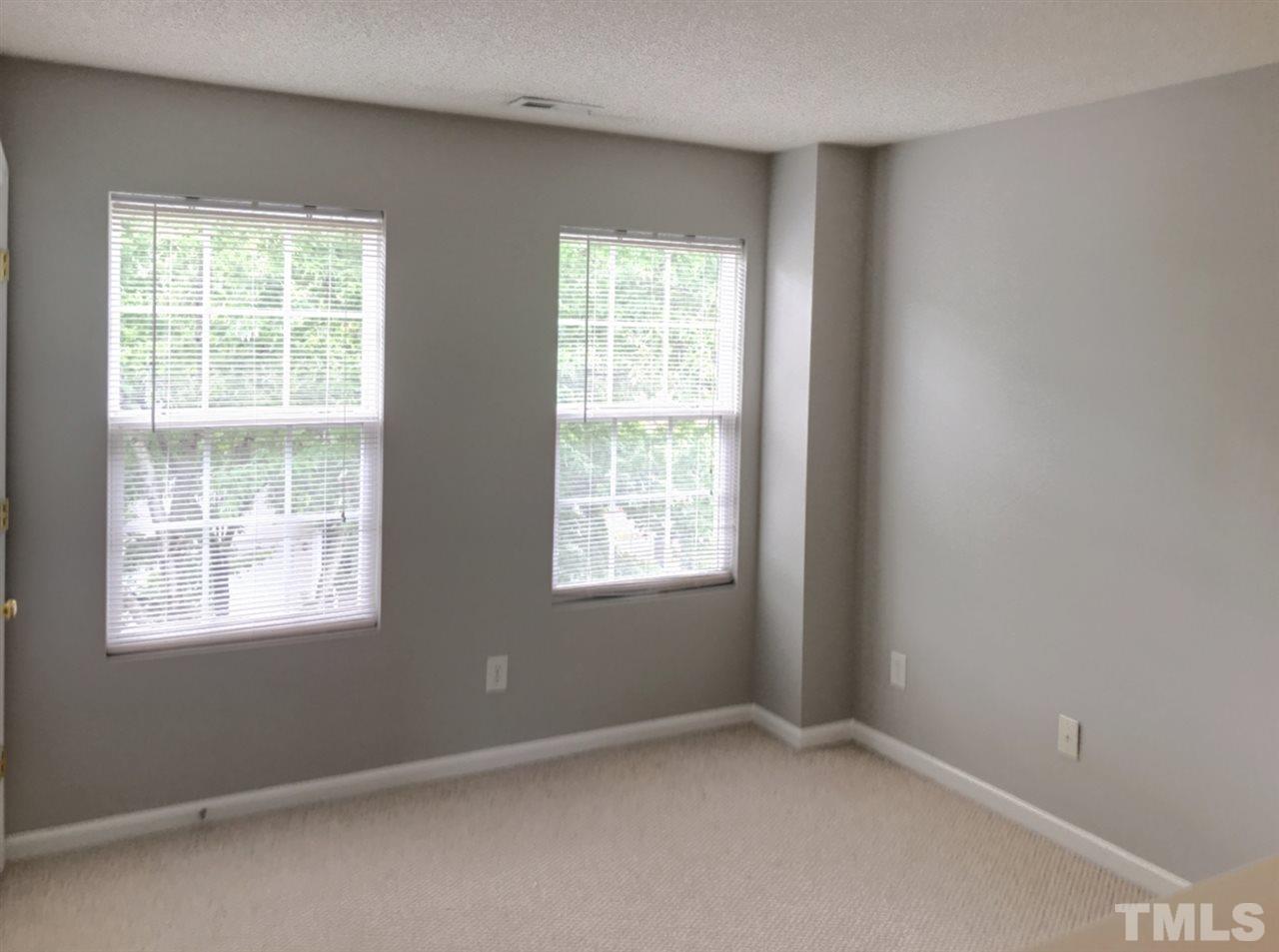 208 Rapp Lane Apex, NC 27502 - Photo 9 of 16 an empty room with a window