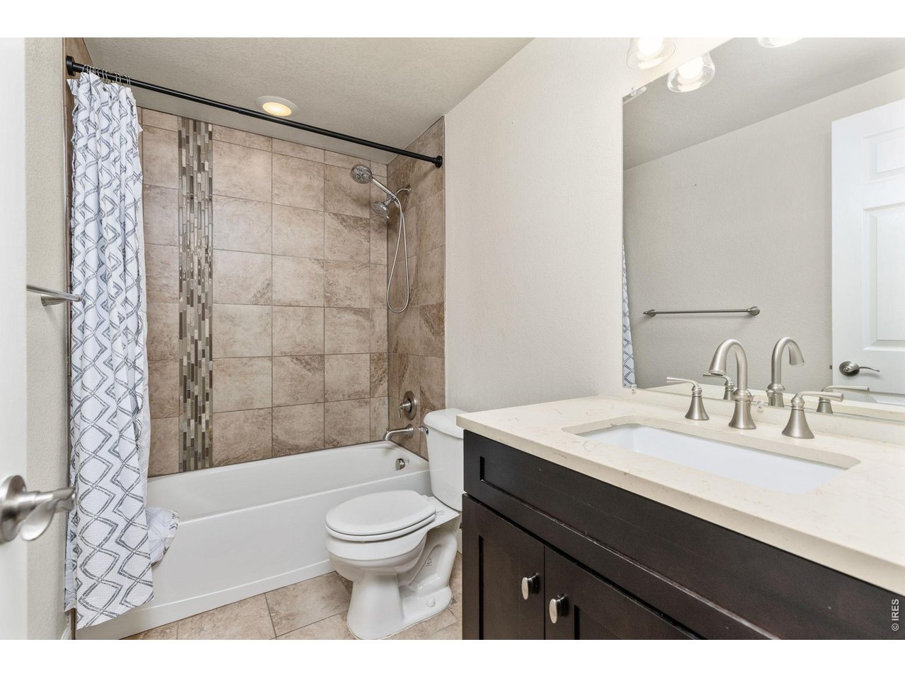 2002 Trail Ridge Drive Severance, CO 80615 - Photo 31 of 50 The basement also features two bedrooms and an updated full bathroom. Bathroom features tile shower, tile flooring, updated vanity & lighting!