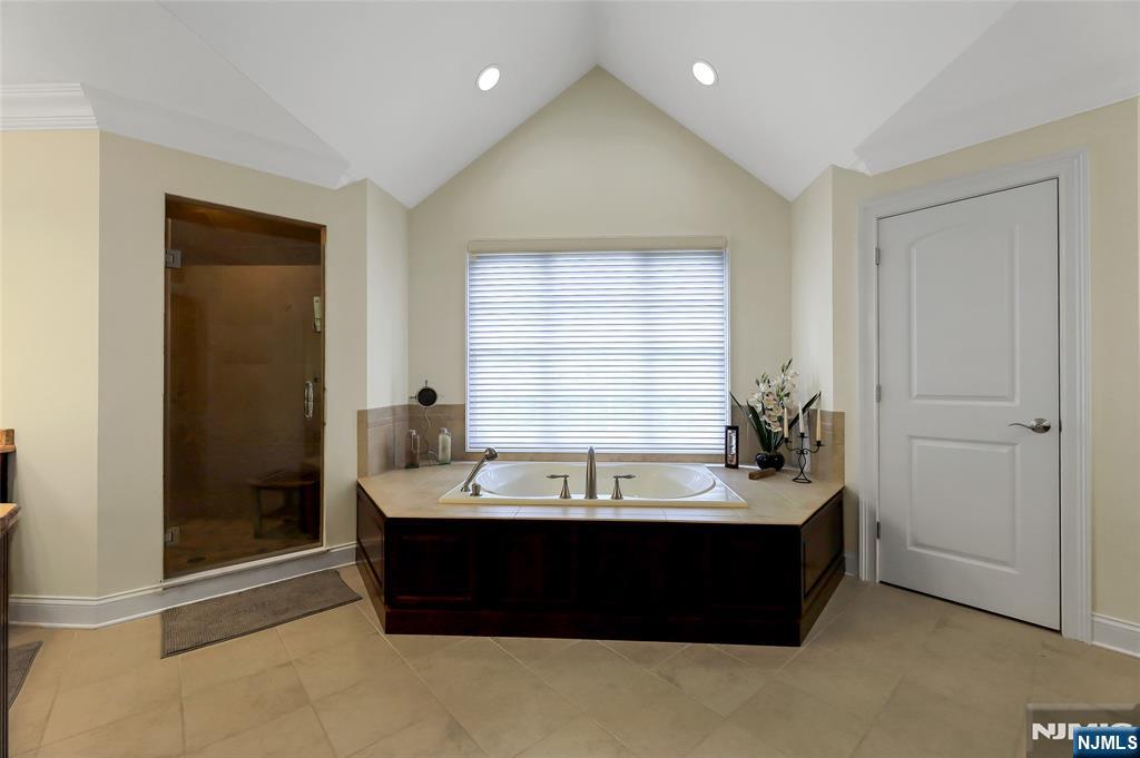 22 Meadowlake Drive Mahwah, NJ 07430 - Photo 31 of 39 a bathroom with a bathtub and a sink