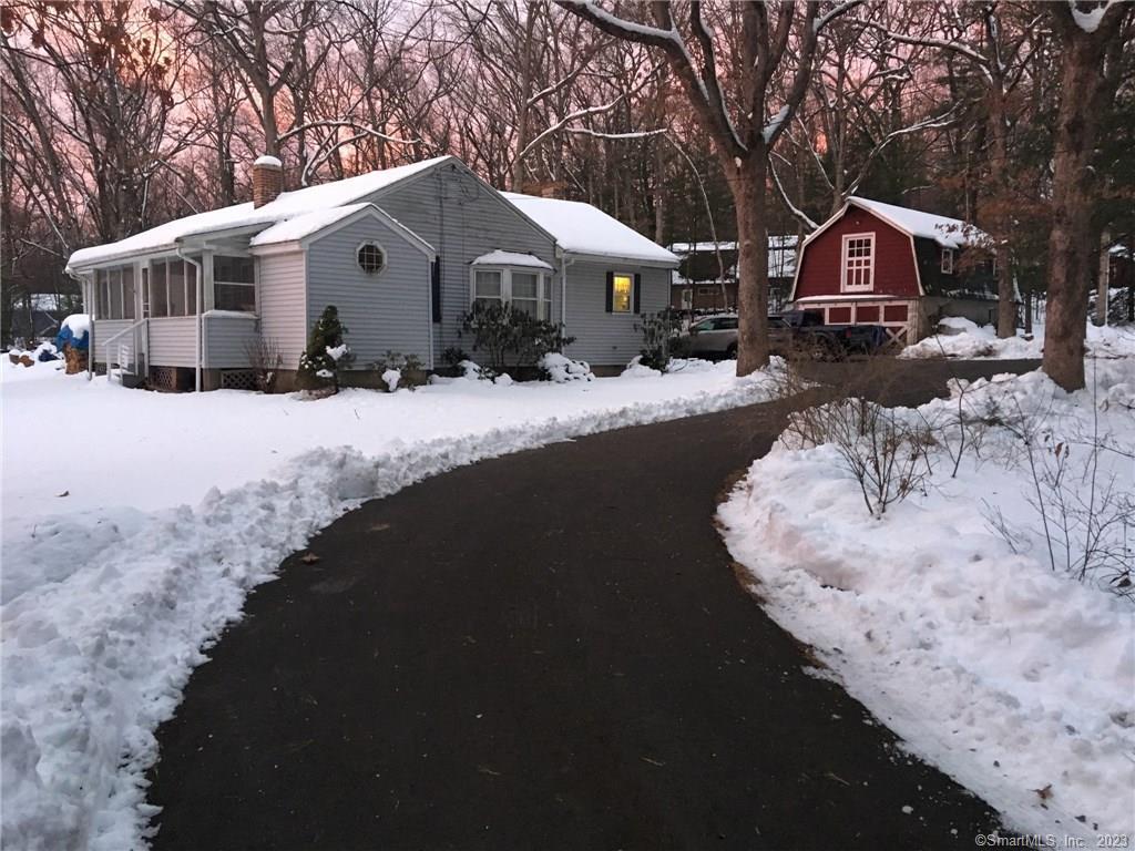 7 Coppermine Road Farmington, CT 06032 - Photo 1 of 1 a front view of a house with a yard covered in snow