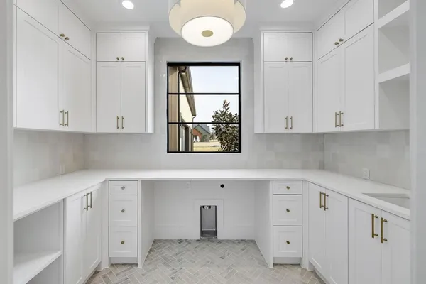a bathroom with a double vanity sink a large mirror and shower