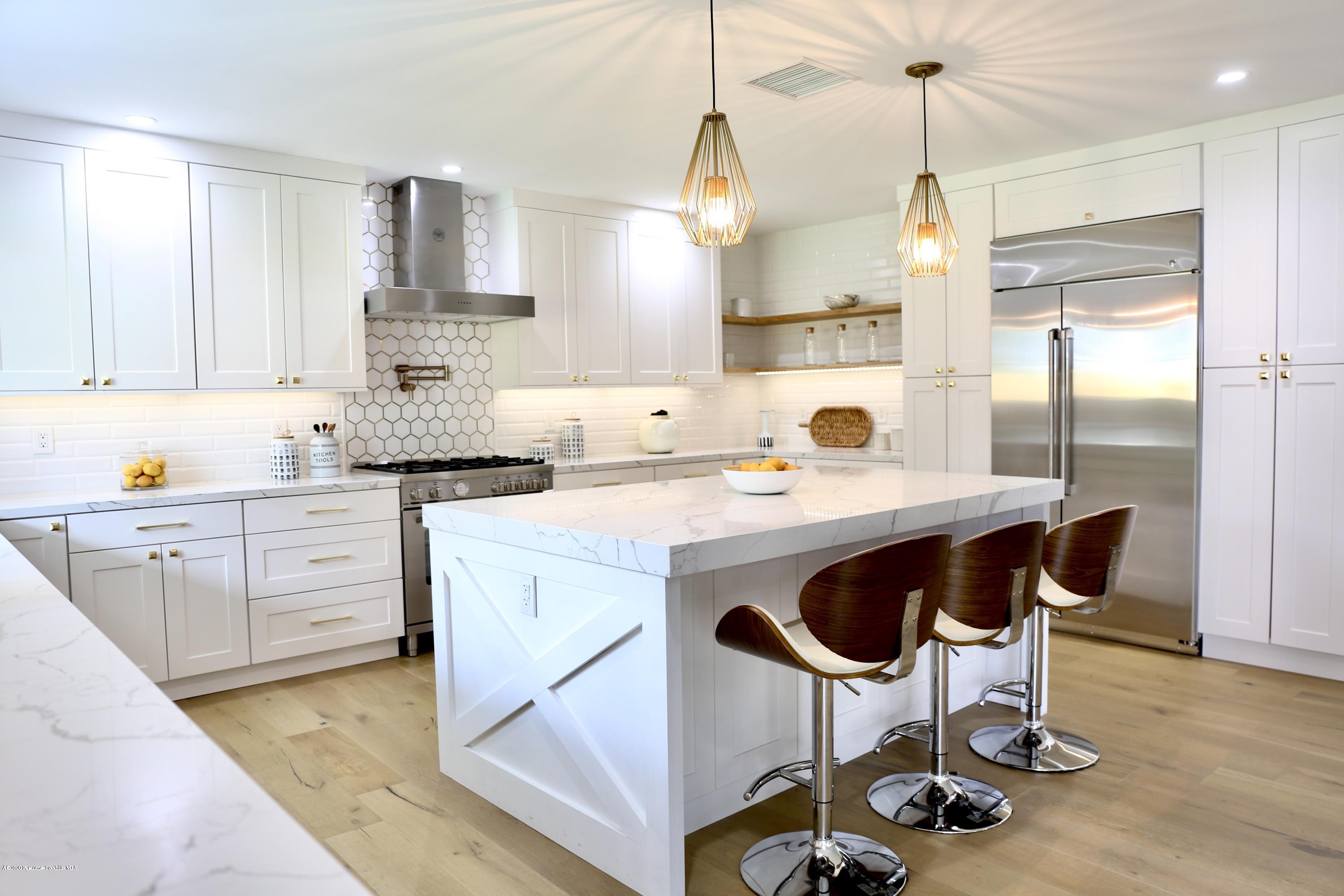 3665 Thorndale Road Pasadena, CA 91107 - Photo 18 of 45 a kitchen with a sink a stove a refrigerator and cabinets