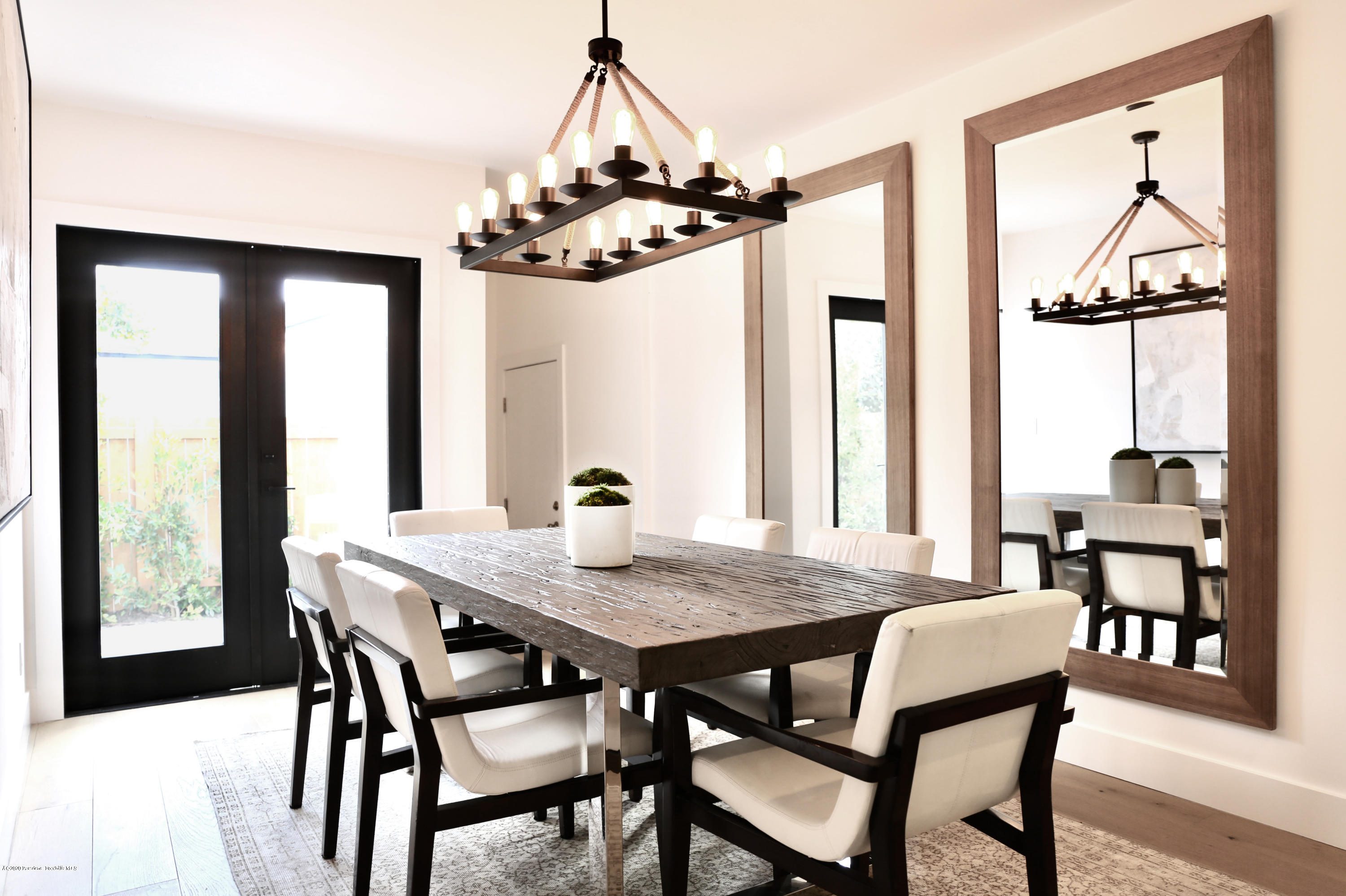 3665 Thorndale Road Pasadena, CA 91107 - Photo 20 of 45 a view of a dining room and livingroom with furniture wooden floor a chandelier