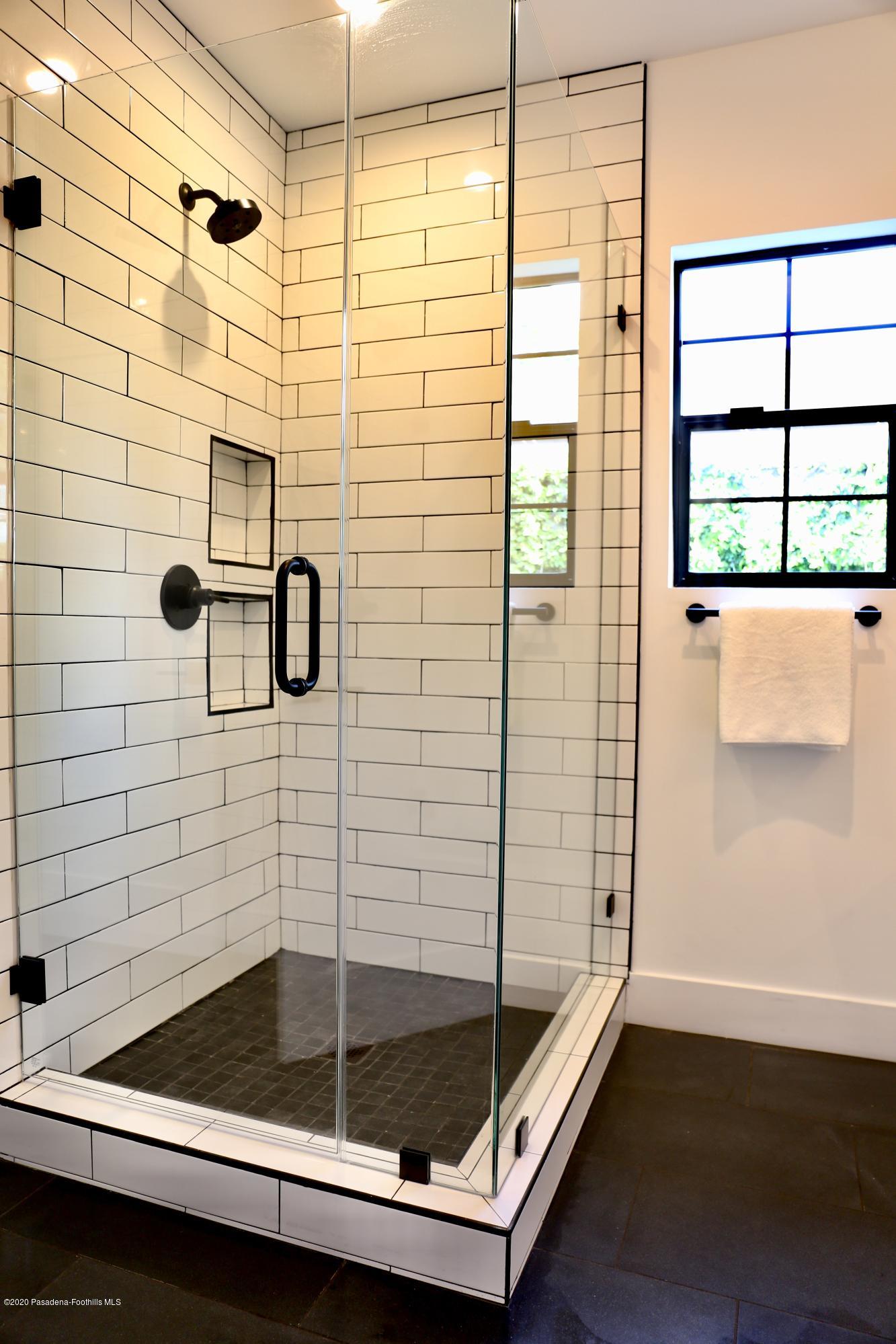 3665 Thorndale Road Pasadena, CA 91107 - Photo 27 of 45 a bathroom with a shower and a sink