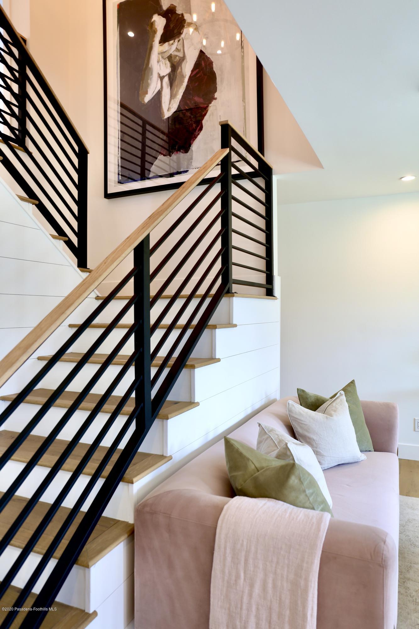 3665 Thorndale Road Pasadena, CA 91107 - Photo 28 of 45 a bedroom with a bed and a painting on the wall