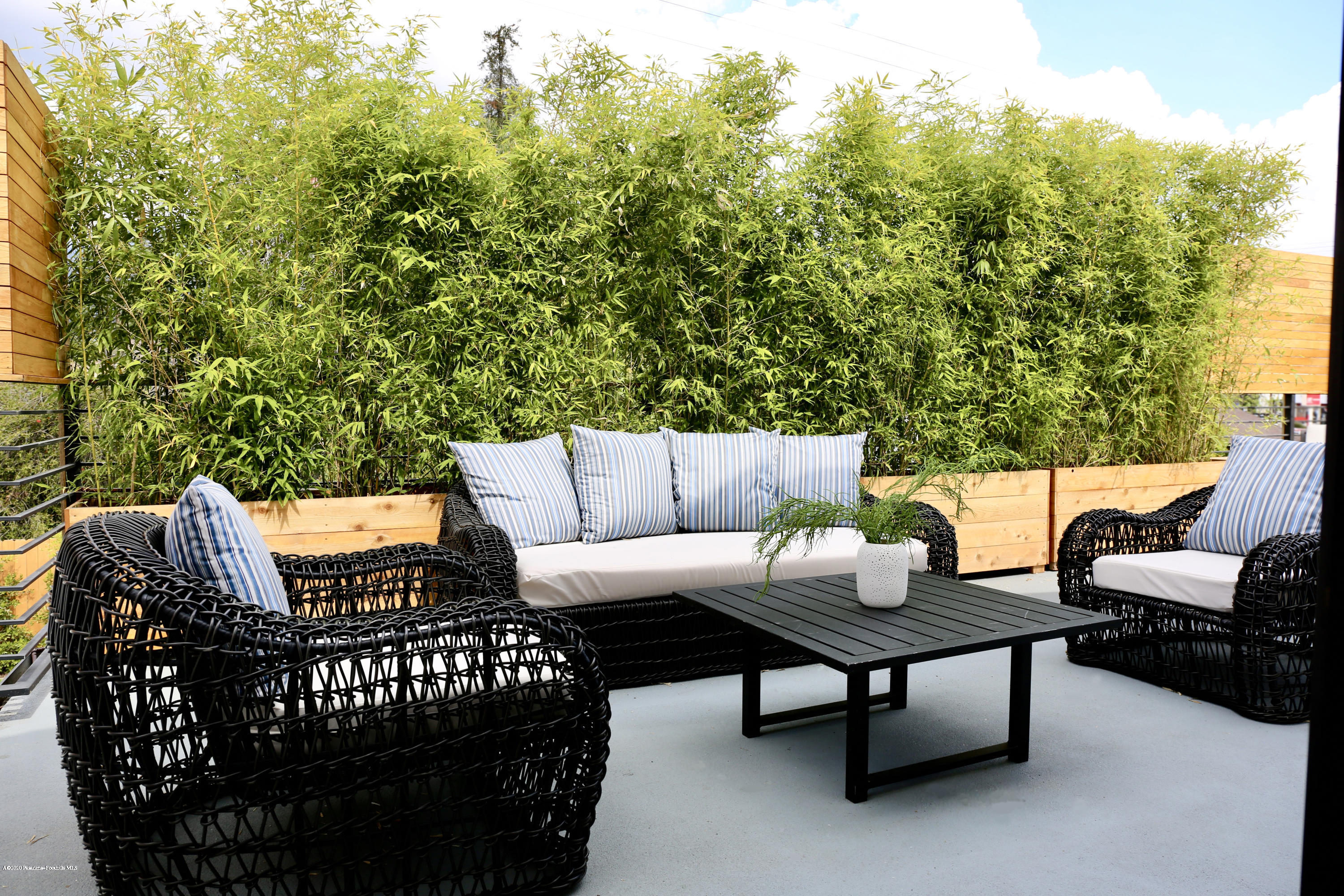 3665 Thorndale Road Pasadena, CA 91107 - Photo 34 of 45 a roof deck with couches and wooden fence