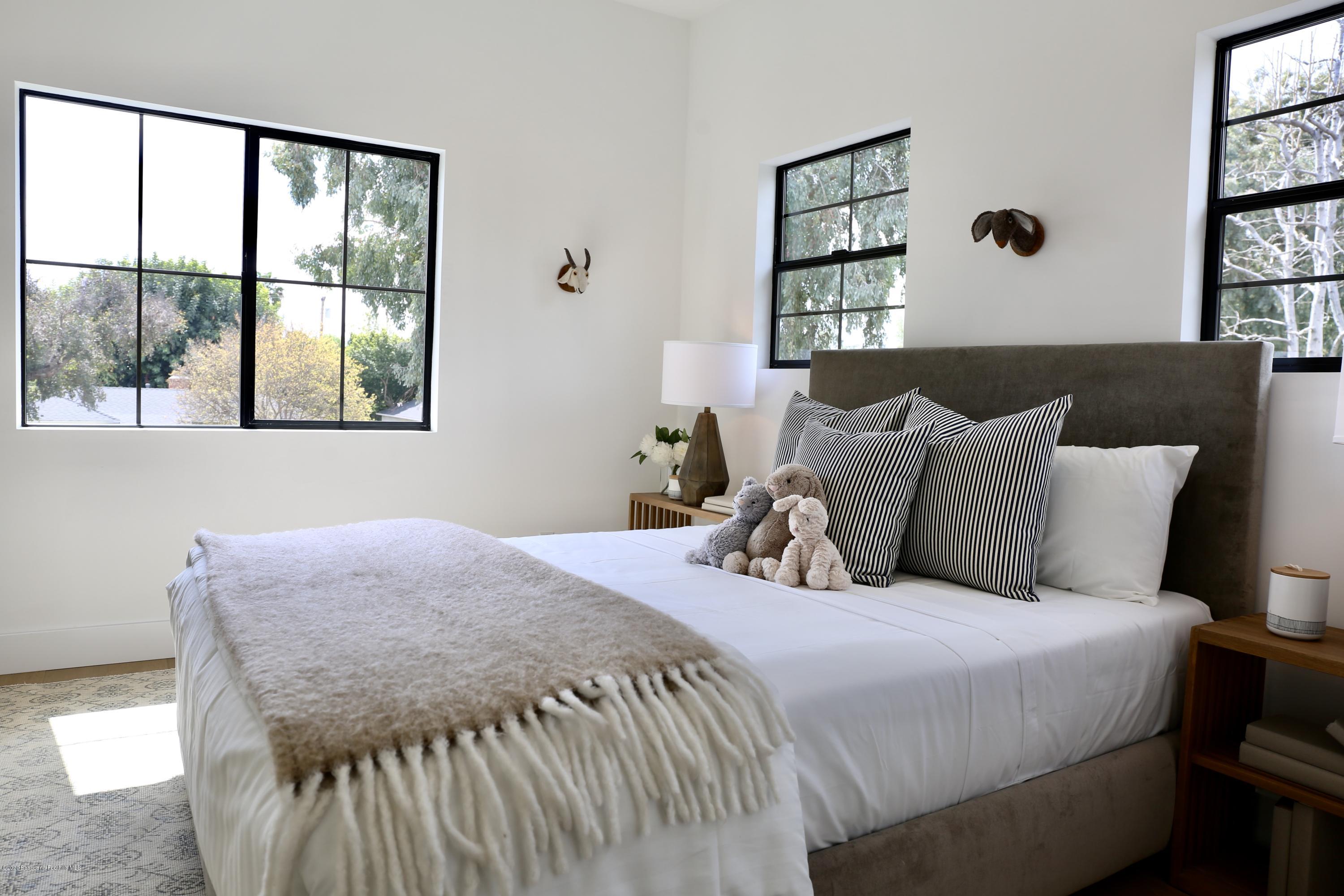 3665 Thorndale Road Pasadena, CA 91107 - Photo 38 of 45 a bedroom with a bed and a window