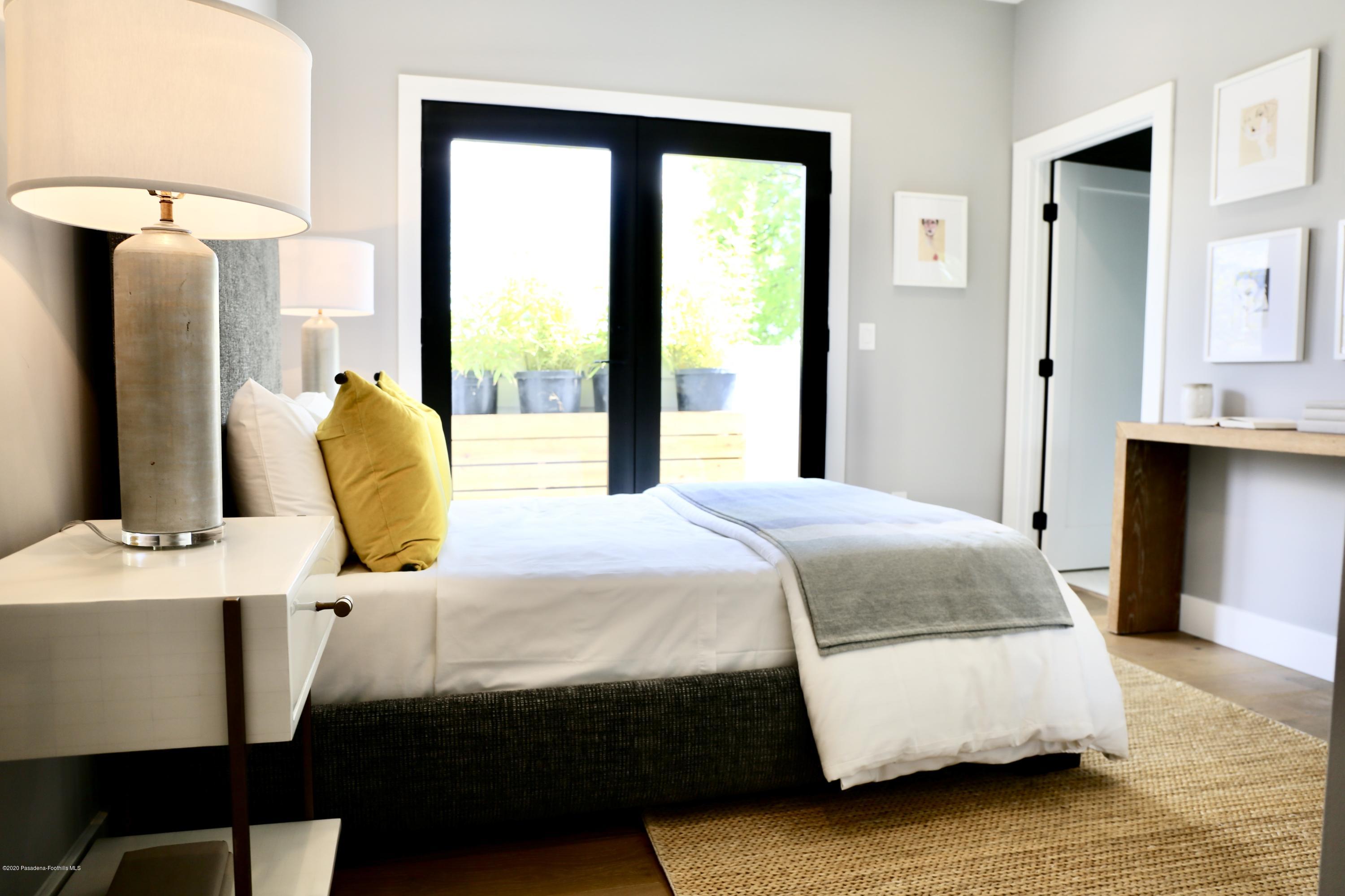 3665 Thorndale Road Pasadena, CA 91107 - Photo 41 of 45 a bedroom with a bed and a table