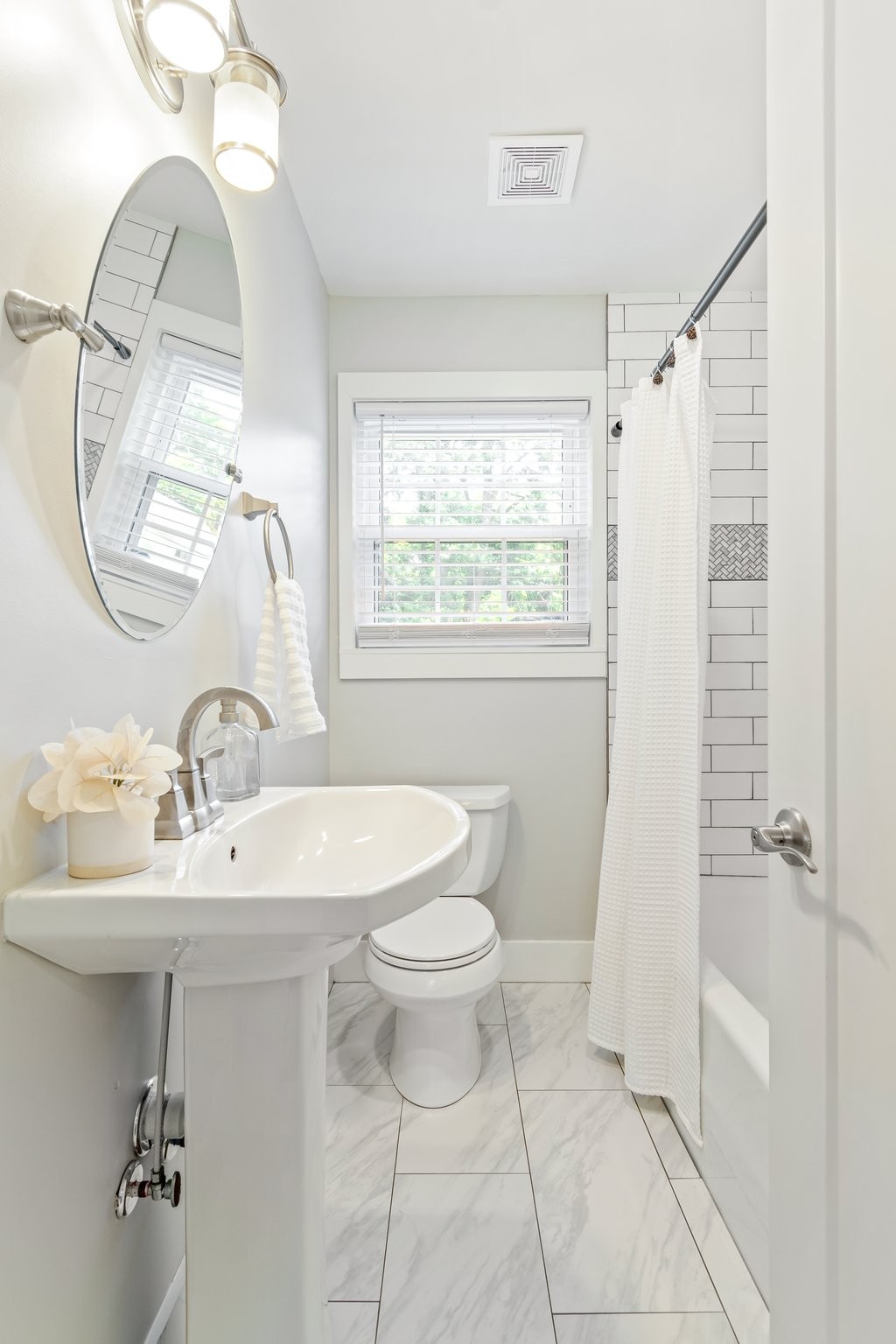 884 Kipling Drive Nashville, TN 37217 - Photo 19 of 40 a bathroom with a sink toilet and a mirror