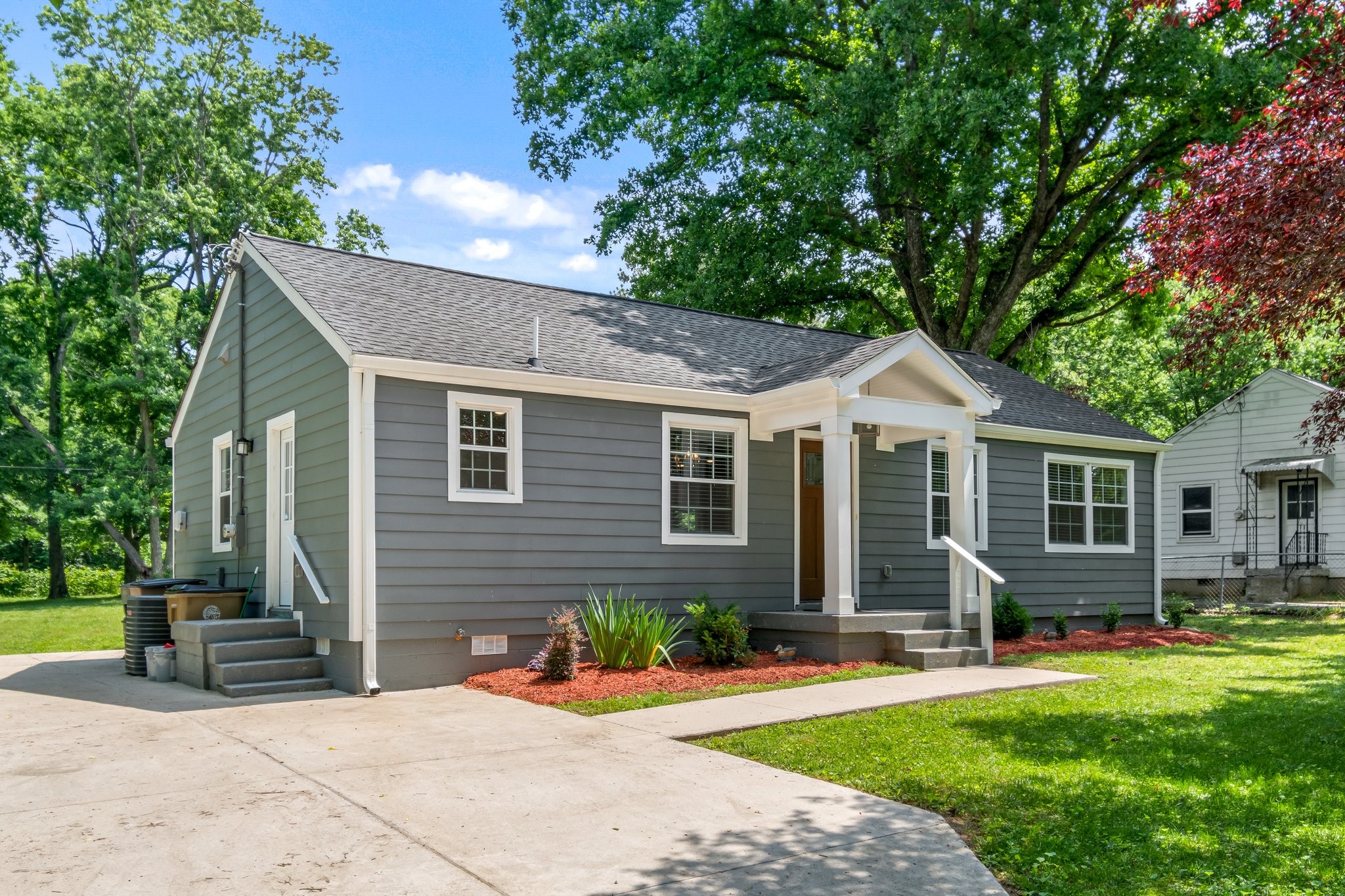 884 Kipling Drive Nashville, TN 37217 - Photo 3 of 40 a front view of a house with yard patio and green space