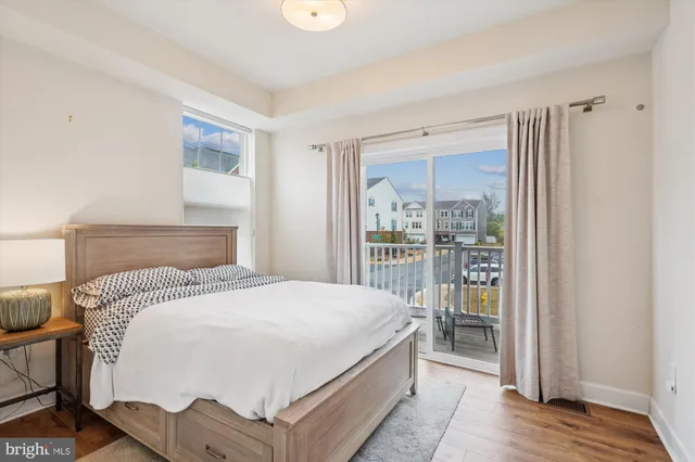 a bedroom with a bed and a shower