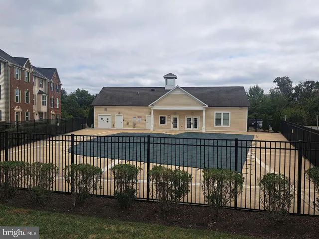 a view of a house with swimming pool and porch